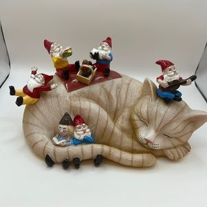 Sleeping cat, gnomes, picnic with granny.